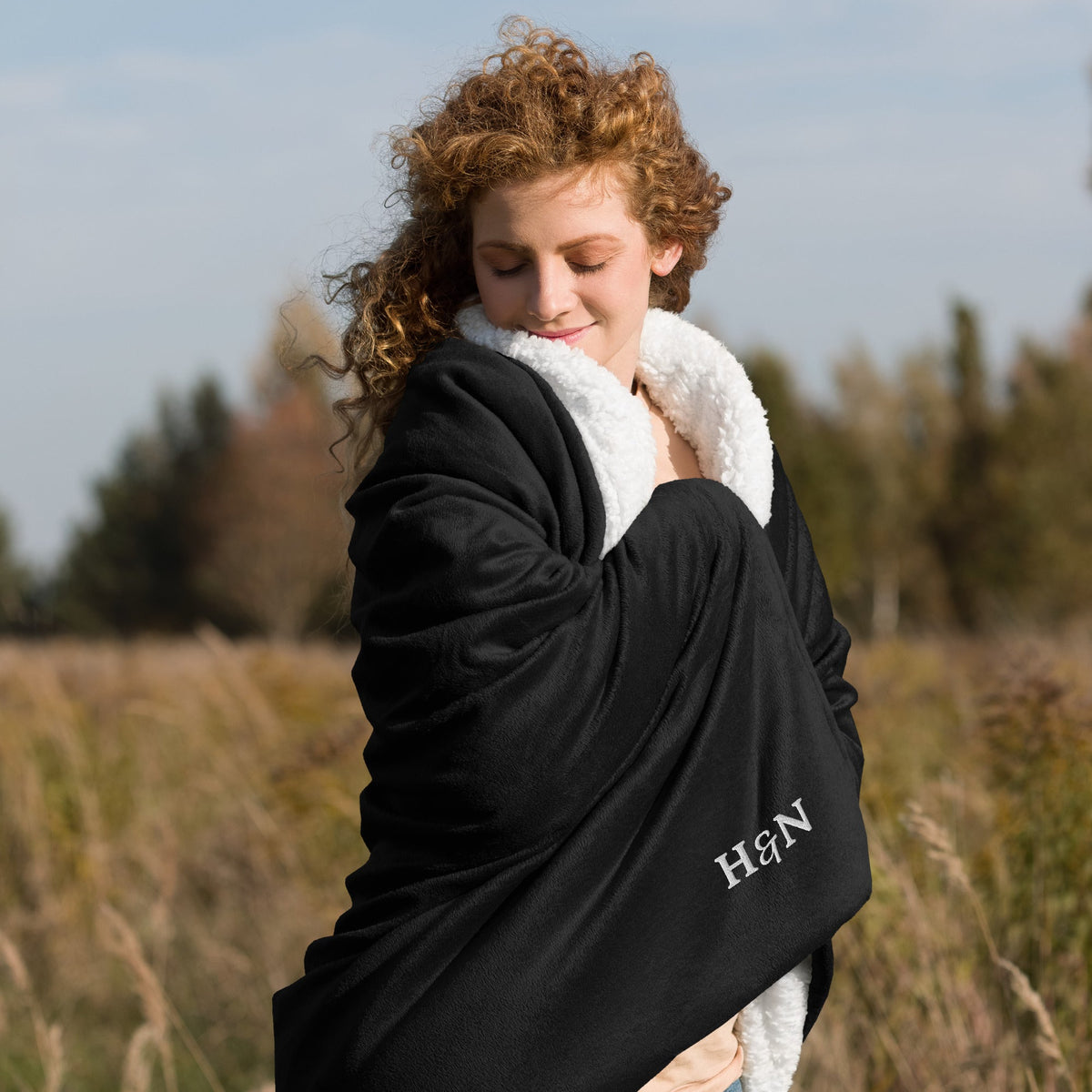 The Sherpa Blanket in black, front view.