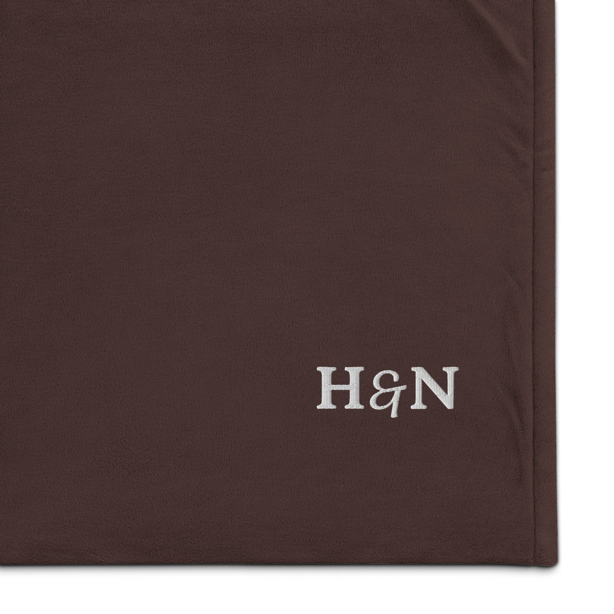 Close view of the Sherpa Blanket in fireside brown.